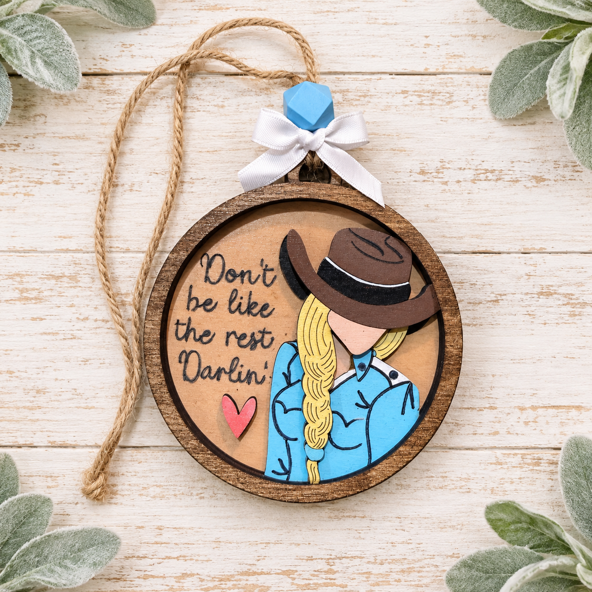Handcrafted cowgirl ornament reading Don't be like the rest Darlin'