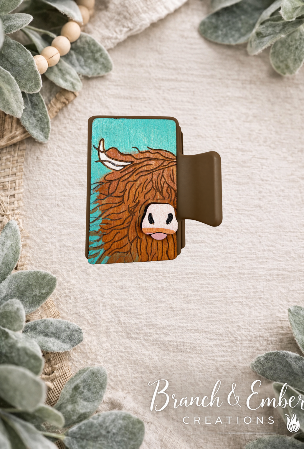 Highland cow 2-inch handcrafted wooden hair claw clip on the approved Branch and Ember backdrop