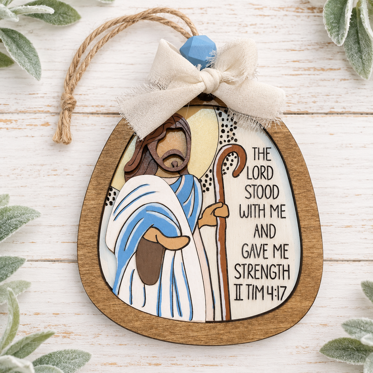 Hand-painted shepherd Scripture ornament featuring 2 Timothy 4:17