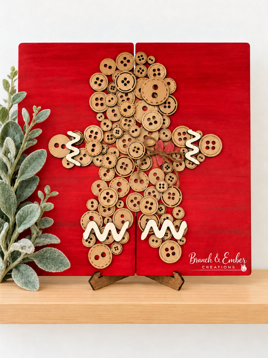 Button Gingerbread Man shelf sitter on red wood panels with cream icing accents and a rustic bow.