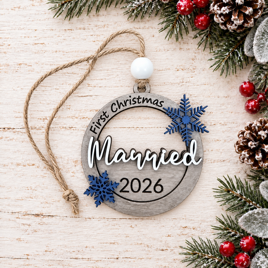 First Christmas Married 2026 handcrafted ornament with blue snowflakes