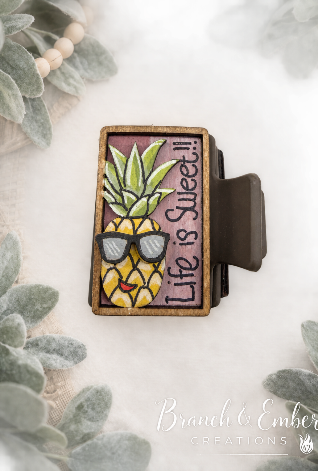 Life Is Sweet pineapple 2-inch handcrafted wooden hair claw clip on Branch and Ember botanical backdrop